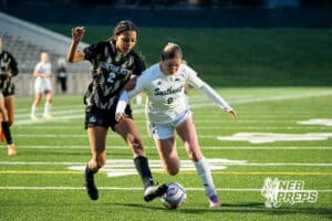 Southwest’s Ansley Throener (9) guarded by Southeast’s Avaerie Graves (2) during a high school girls’ soccer game on Tuesday, March 31, 2026, in Lincoln, Nebraska. Photo by Jackson D. Luethje.