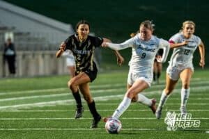Southwest’s Ansley Throener (9) guarded by Southeast’s Avaerie Graves (2) during a high school girls’ soccer game on Tuesday, March 31, 2026, in Lincoln, Nebraska. Photo by Jackson D. Luethje.