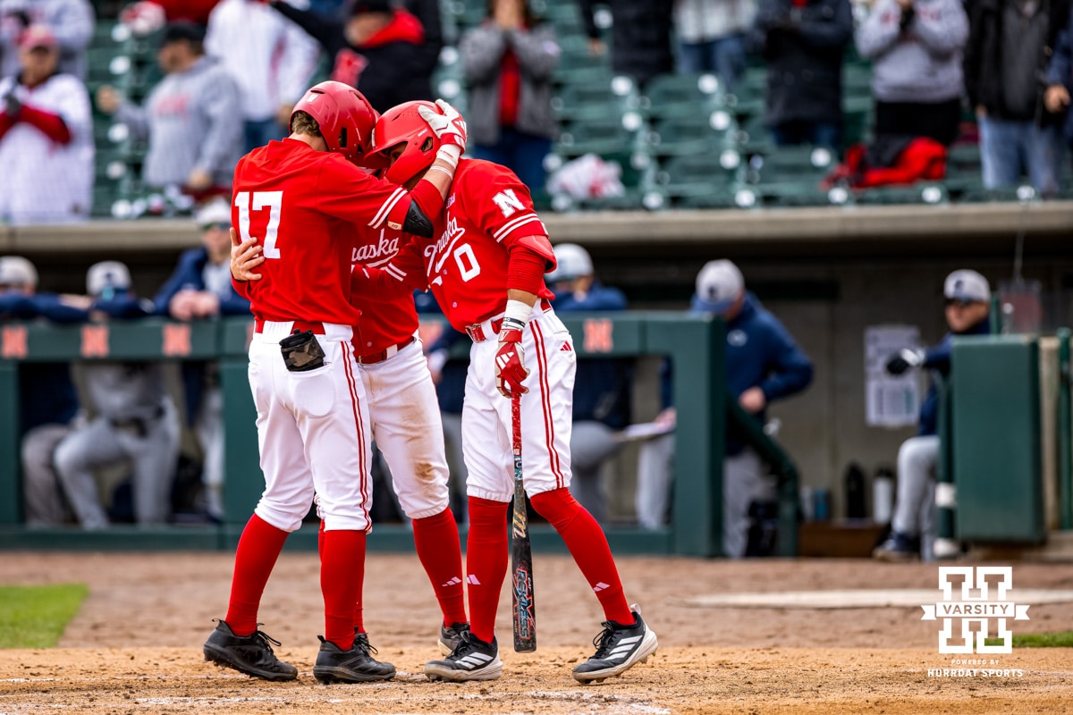 Nebraska’s Mac Moyer (17) is embracing his teammates after hitting a homerun during a collegiate baseball game against Penn State on Saturday, April 4, 2026, in Lincoln, Nebraska. Photo By Jack Stephens.