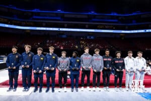 Brandon Dang, Illinois; Garrett Schooley, Illinois; Carson Eshleman, Michigan; Chase Pappas, Michigan; Fred Richard, Michigan; Asher Cohen, Nebraska; Max Odden, Nebraska; Nathan York, Nebraska; Chase Davenport-Mills, Ohio State; David Ramirez, Ohio State; Kellen Ryan, Penn State; Landon Simpson, Penn State made the first team during the Big Ten Men’s Gymnastics Championships on Saturday, April 4, 2026, in Lincoln. Photo by John S. Peterson.