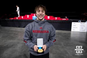 Nebraska Cornhusker Asher Cohen poses for a photo holding his medal for first place in the still rings during the Big Ten Men’s Gymnastics Championships on Saturday, April 4, 2026, in Lincoln. Photo by John S. Peterson.