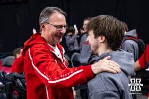 Nebraska Cornhusker head coach Chuck Chmelka congratulates Asher Cohen on taking first on the still rings during the Big Ten Men’s Gymnastics Championships on Saturday, April 4, 2026, in Lincoln. Photo by John S. Peterson.