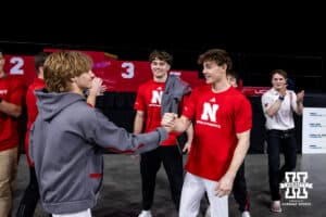Nebraska Cornhusker Nathan York shakes hands with Caden Clinton after taking first and Clinton takes seonc in the parallel bars during the Big Ten Men’s Gymnastics Championships on Saturday, April 4, 2026, in Lincoln. Photo by John S. Peterson.