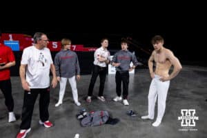 Nebraska Cornhusker Nathan York (right) waits to see his score on the parallel bars during the Big Ten Men’s Gymnastics Championships on Saturday, April 4, 2026, in Lincoln. Photo by John S. Peterson.
