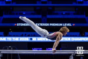 Nebraska Cornhusker Caden Clinton performs on the parallel bars during the Big Ten Men’s Gymnastics Championships on Saturday, April 4, 2026, in Lincoln. Photo by John S. Peterson.