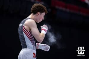 Nebraska Cornhusker Max Odden prepares to perform on the high bar during the Big Ten Men’s Gymnastics Championships on Saturday, April 4, 2026, in Lincoln. Photo by John S. Peterson.