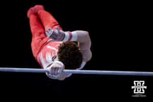 Nebraska Cornhusker Max Odden performs on the bar during the Big Ten Men's Gymnastics Team Championship on Friday, April 3, 2026, in Lincoln. Photo by John S. Peterson.