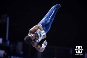 Michigan Wolverine and Olympic athlete Fred Richard performs on the high bar during the Big Ten Men's Gymnastics Team Championship on Friday, April 3, 2026, in Lincoln. Photo by John S. Peterson.