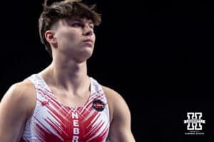 Nebraska Cornhusker Wyatt Renolds' and all the Husker uniforms has a badge remembering Jim Hartung during the Big Ten Men's Gymnastics Team Championship on Friday, April 3, 2026, in Lincoln. Photo by John S. Peterson.