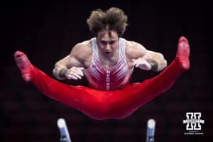 Nebraska Cornhuskser Asher Cohen warms up on the bars during the Big Ten Men's Gymnastics Team Championship on Friday, April 3, 2026, in Lincoln. Photo by John S. Peterson.