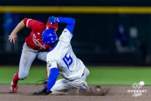 Creighton Bluejay base runner Rocco Gump (15) slides to second for a steal against the Nebraska Cornhuskers in the ninth inning during a college baseball game on Tuesday, March 31, 2026, in Omaha. Photo by John S. Peterson.