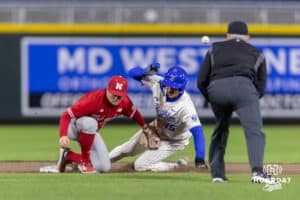 Creighton Bluejay Rocco Gump (15) slides at second for the steal against Nebraska Cornhusker infielder Rhett Stokes (9) in the sixth inning during a college baseball game on Tuesday, March 31, 2026, in Omaha. Photo by John S. Peterson.