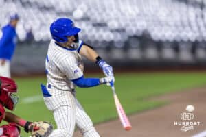 Creighton Bluejay catcher Nate McHugh (5) doubles in the sixth inning, scoring two runs against the Nebraska Cornhuskers during a college baseball game on Tuesday, March 31, 2026, in Omaha. Photo by John S. Peterson.