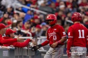 Nebraska Cornhusker catcher Jeter Worthley (0) runs to the dugout after scoring a run against the Creighton Bluejays in the fifth inning during a college baseball game on Tuesday, March 31, 2026, in Omaha. Photo by John S. Peterson.
