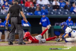 Nebraska Cornhusker Jeter Worthley (0) slides at home scoring a run against the Creighton Bluejays in the fifth inning during a college baseball game on Tuesday, March 31, 2026, in Omaha. Photo by John S. Peterson.