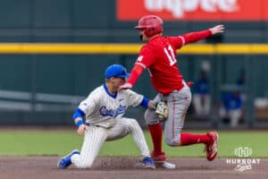 Nebraska Cornhusker outfielder Max Buettenback (11) steals second on a wild pitch against the Creighton Bluejays in the second inning during a college baseball game on Tuesday, March 31, 2026, in Omaha. Photo by John S. Peterson.