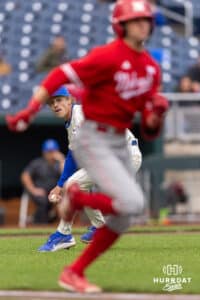 Nebraska Cornhusker Jett Buck (1) hits a single as Creighton Bluejay pitcher Ian Koosman (24) tries to field the ball during a college baseball game on Tuesday, March 31, 2026, in Omaha. Photo by John S. Peterson.