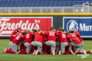 Nebraska Cornhuskers huddle up before the start of the game against the Creighton Bluejays during a college baseball game on Tuesday, March 31, 2026, in Omaha. Photo by John S. Peterson.