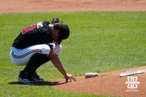 Nebraska Cornhusker Gavin Blachowicz (50) kneels during a regional baseball game against Arizona State on May 31, 2026, in Lincoln, Nebraska. Photo by Brandon Tiedemann.