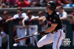 Nebraska Cornhusker Joshua Overbeek (4) watches his ball during a regional baseball game against Arizona State on May 31, 2026, in Lincoln, Nebraska. Photo by Brandon Tiedemann.