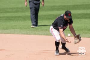 Nebraska Cornhusker Dylan Carey (15) bobbles the throw during a regional baseball game against Arizona State on May 31, 2026, in Lincoln, Nebraska. Photo by Brandon Tiedemann.