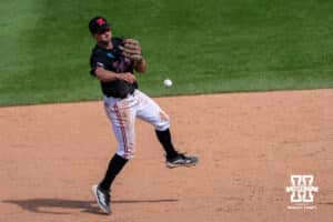 Nebraska Cornhusker Dylan Carey (15) throws to first base during a regional baseball game against Arizona State on May 31, 2026, in Lincoln, Nebraska. Photo by Brandon Tiedemann.