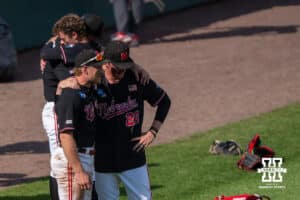 Nebraska Cornhusker Joshua Overbeek (4) and Kevin Mannell (20) speak after a regional baseball game against Arizona State on May 31, 2026, in Lincoln, Nebraska. Photo by Brandon Tiedemann.