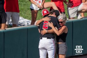 Nebraska Cornhusker Ty Horn (2) hugs family during a regional baseball game against Arizona State on May 31, 2026, in Lincoln, Nebraska. Photo by Brandon Tiedemann.