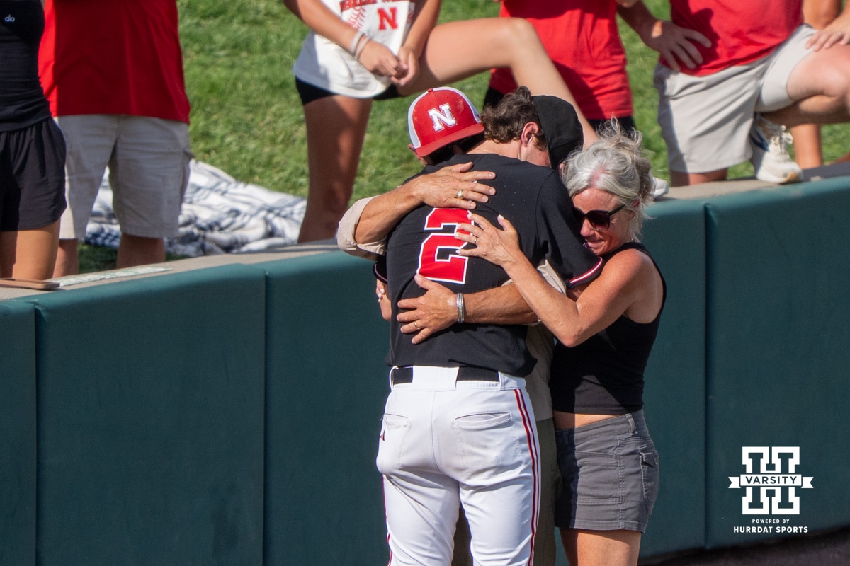 Nebraska Cornhusker Ty Horn (2) hugs family during a regional baseball game against Arizona State on May 31, 2026, in Lincoln, Nebraska. Photo by Brandon Tiedemann.