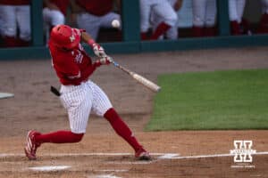 Nebraska Cornhusker Jeter Worthley (0) hits the ball foul during a regional baseball game against Ole Miss on May 30, 2026, in Lincoln, Nebraska. Photo by Brandon Tiedemann.