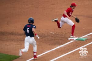 Nebraska Cornhusker Ty Horn (2) tags first base during a regional baseball game against Ole Miss on May 30, 2026, in Lincoln, Nebraska. Photo by Brandon Tiedemann.