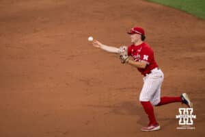 Nebraska Cornhusker Rhett Stokes (9) throws to first base during a regional baseball game against Ole Miss on May 30, 2026, in Lincoln, Nebraska. Photo by Brandon Tiedemann.