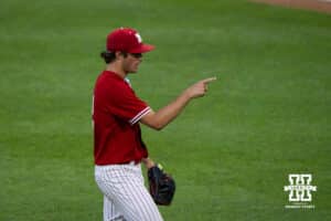 Nebraska Cornhusker Ty Horn (2) points to his teammate during a regional baseball game against Ole Miss on May 30, 2026, in Lincoln, Nebraska. Photo by Brandon Tiedemann.
