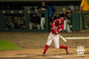 Nebraska Cornhusker Max Buettenback (11) hits a home run during a regional baseball game against Ole Miss on May 30, 2026, in Lincoln, Nebraska. Photo by Brandon Tiedemann.