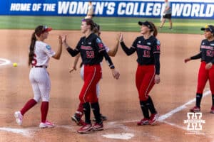 Nebraska Cornhuskers and Alabama Crimson Tide shake hands after the game during the WCWS second round on Saturday, May 30, 2026, in Oklahoma City. Photo by John S. Peterson.