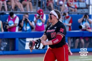 Nebraska Cornhusker relief pitcher Alexis Jensen (99) celebrates after stiking out three Alabama Crimson Tide batter in the fifth inning during the WCWS second round on Saturday, May 30, 2026, in Oklahoma City. Photo by John S. Peterson.