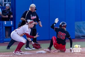 Nebraska Cornhusker catcher Jesse Farrell (25) advances to third on a SAC fly in the fifth inning against the Alabama Crimson Tide during the WCWS second round on Saturday, May 30, 2026, in Oklahoma City. Photo by John S. Peterson.