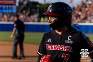 Nebraska Cornhusker Ava Kuszak (7) heads to the dugout against the Alabama Crimson Tide in the fourth inning during the WCWS second round on Saturday, May 30, 2026, in Oklahoma City. Photo by John S. Peterson.