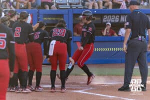 Nebraska Cornhusker starting pitcher/relief pitcher Hannah Camenzind (9) steps on home plate after hitting a home run in the fourth against the Alabama Crimson Tide during the WCWS second round on Saturday, May 30, 2026, in Oklahoma City. Photo by John S. Peterson.