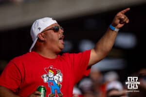 Nebraska Cornhuskers fan leads a "Go Big Red" chant against the Alabama Crimson Tide during the WCWS second round on Saturday, May 30, 2026, in Oklahoma City. Photo by John S. Peterson.