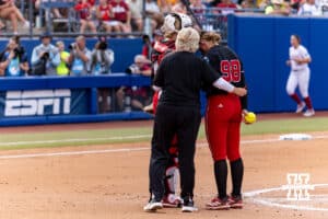 Nebraska Cornhusker head coach Rhonda Revelle makes a visit to the mount with Jordy Frahm in the first inning during the WCWS second round on Saturday, May 30, 2026, in Oklahoma City. Photo by John S. Peterson.