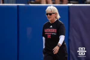 Nebraska Cornhusker head coach Rhonda Revelle walks to dugout against the Alabama Crimson Tide during the WCWS second round on Saturday, May 30, 2026, in Oklahoma City. Photo by John S. Peterson.