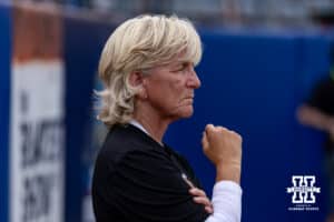 Nebraska Cornhusker head coach Rhonda Revelle watching warm-up before taking on the Alabama Crimson Tide during the WCWS second round on Saturday, May 30, 2026, in Oklahoma City. Photo by John S. Peterson.