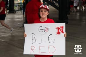 A young Nebraska Cornhusker fan holds up his sign during a regional baseball game against SDSU on May 29, 2026, in Lincoln, Nebraska. Photo by Brandon Tiedemann.