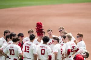 Nebraska Cornhuskers huddle before a regional baseball game against SDSU on May 29, 2026, in Lincoln, Nebraska. Photo by Brandon Tiedemann.