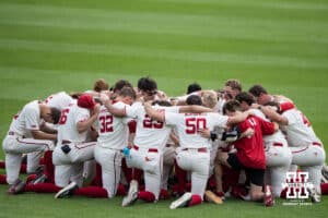Nebraska Cornhuskers huddle during a regional baseball game against SDSU on May 29, 2026, in Lincoln, Nebraska. Photo by Brandon Tiedemann.