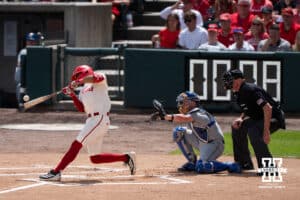 Nebraska Cornhusker Jeter Worthley (0) hits the ball during a regional baseball game against SDSU on May 29, 2026, in Lincoln, Nebraska. Photo by Brandon Tiedemann.