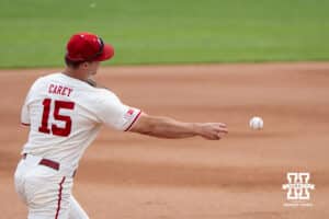 Nebraska Cornhusker Dylan Carey (15) throws to first base during a regional baseball game against SDSU on May 29, 2026, in Lincoln, Nebraska. Photo by Brandon Tiedemann.