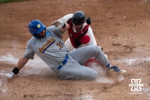 Nebraska Cornhusker Trey Fikes (21) tags out a runner during a regional baseball game against SDSU on May 29, 2026, in Lincoln, Nebraska. Photo by Brandon Tiedemann.