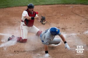 Nebraska Cornhusker Trey Fikes (21) celebrates after tagging a runner out during a regional baseball game against SDSU on May 29, 2026, in Lincoln, Nebraska. Photo by Brandon Tiedemann.